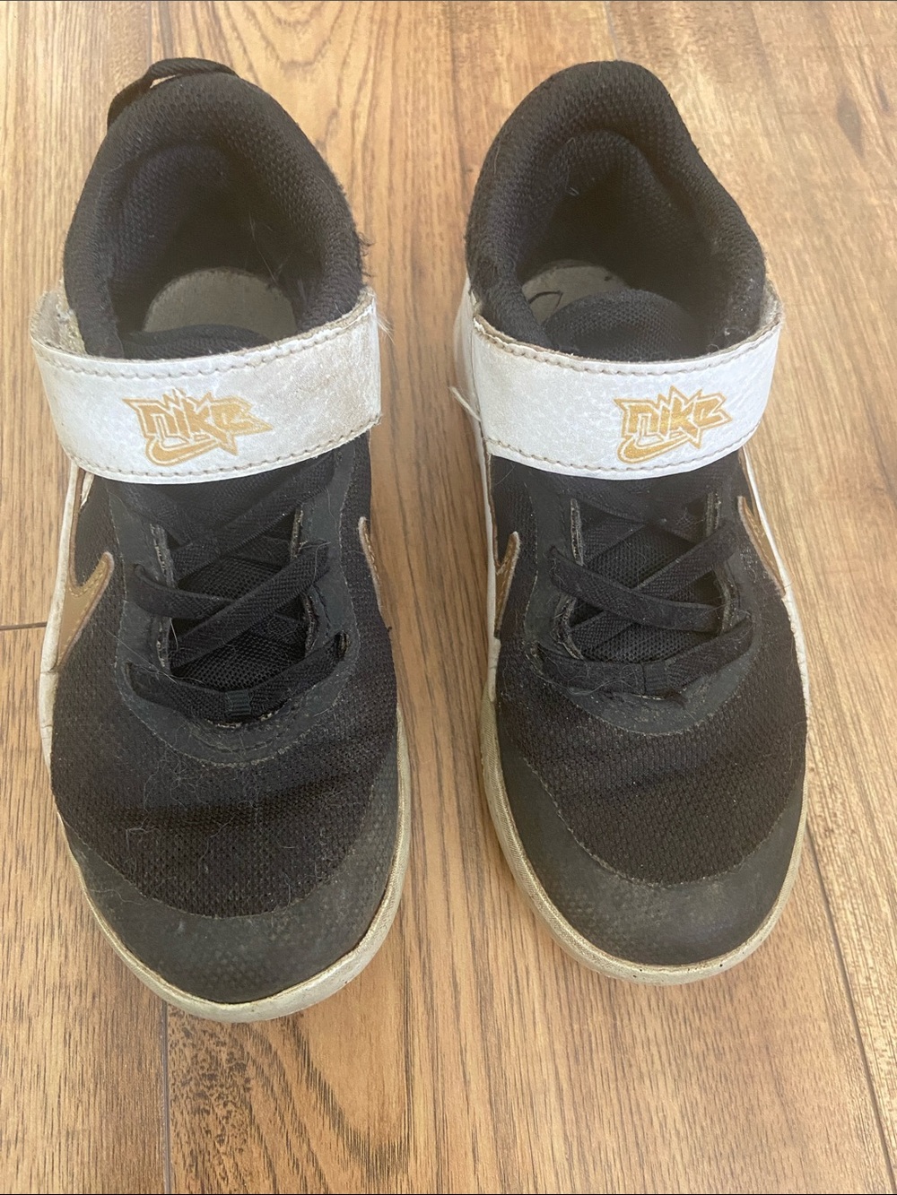 Nike Kids Black and White Sneakers with Gold Logo